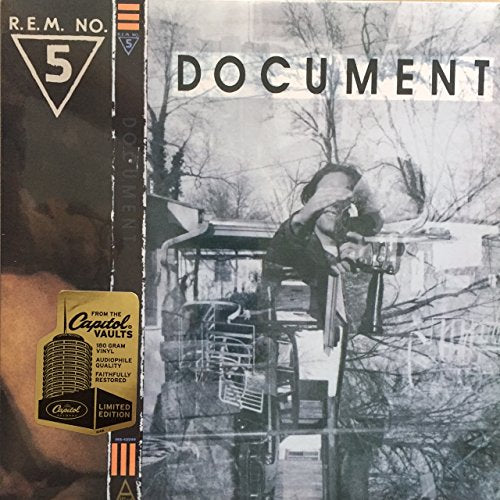 Vinyl album cover for R.E.M. Document featuring a black and white outdoor scene.