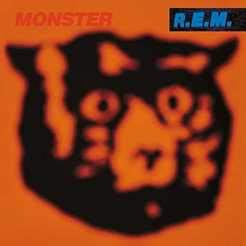 R.E.M. “Monster” album cover: orange background with a black bear-like image.