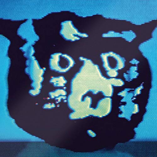 A stylized, pixelated black fur-like shape with light blue features against a blue background.