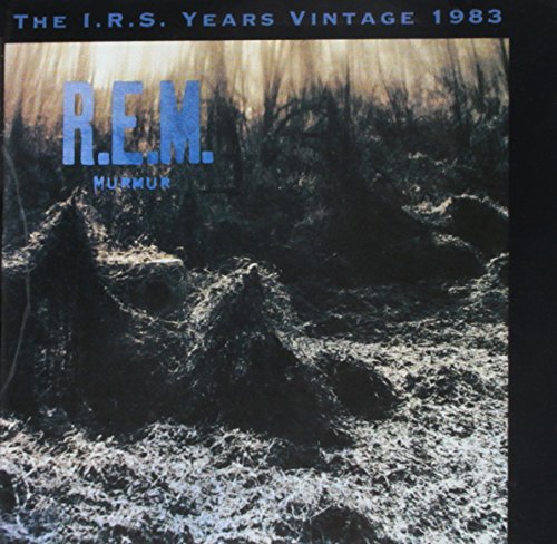 R.E.M.’s “Murmur” CD cover: blue text over a dark, textured forest image.
