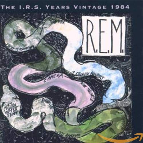 R.E.M. album cover, “Reckoning,” featuring abstract snakes and text.