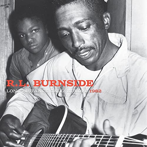 R.L. Burnside album cover, black and white photo of a man playing guitar.