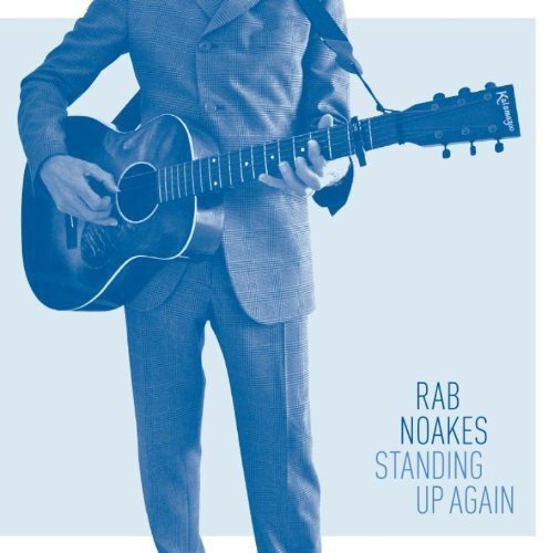 Rab Noakes in suit playing acoustic guitar, album cover art.