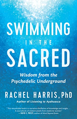 Book cover: "Swimming in the Sacred" with blue, watery background and white text.