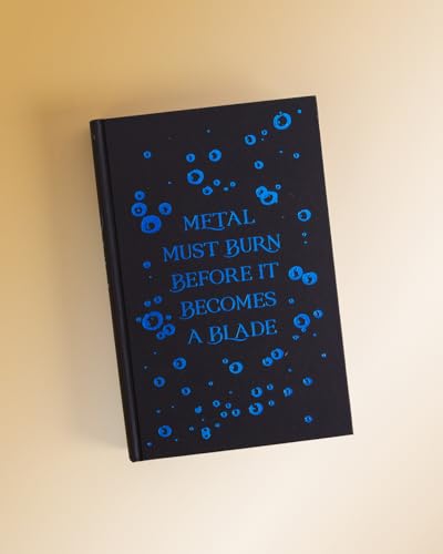 Black book cover with blue text reading Metal Must Burn Before It Becomes A Blade.