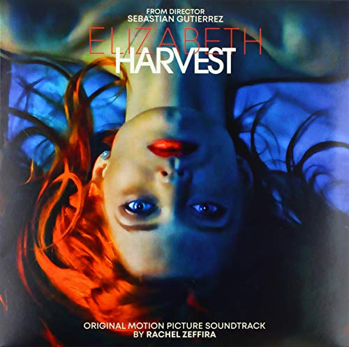 Vinyl cover art featuring an upside-down woman's face with dramatic blue and red lighting.
