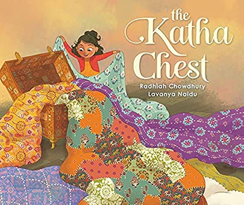 Girl with a large, patterned quilt and a wooden chest.