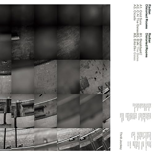 Black and white vinyl album cover with fragmented architectural imagery.