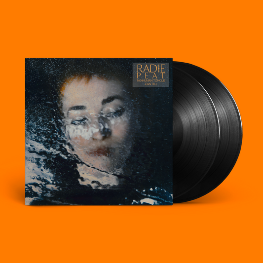 Vinyl record with a blurred portrait of a person on the cover.