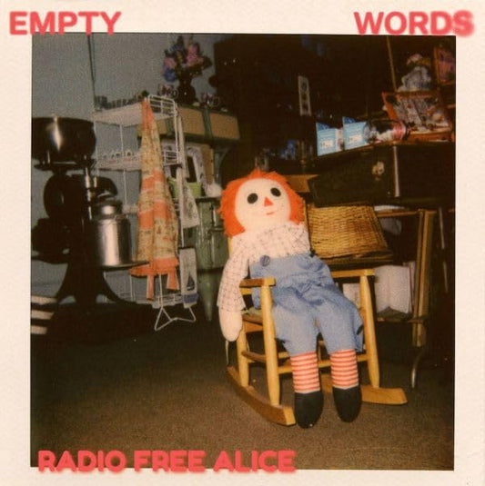 Vinyl album cover: a vintage photo of a doll in a room.