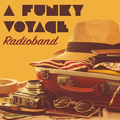 CD cover with vintage travel items: suitcase, camera, hat, and glasses.