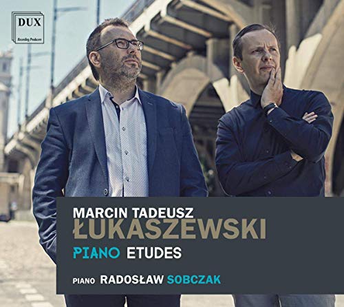 "CD cover featuring two men standing under a bridge, with text overlay."