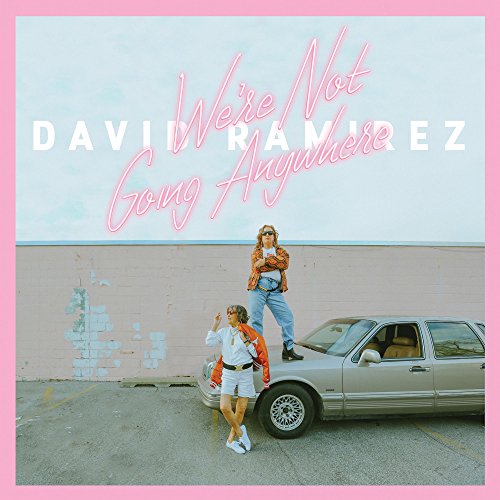 Album cover with two women standing near a car, pink border and text overlay.