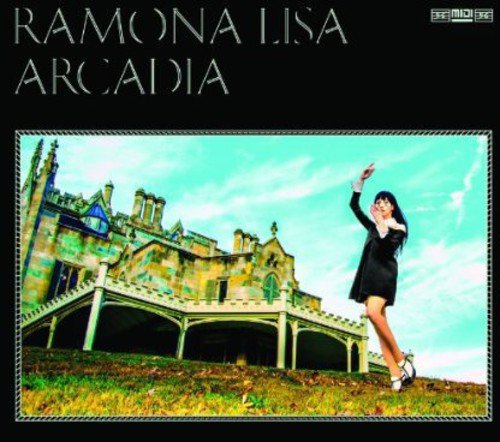 Vinyl album cover: woman in black dress before a castle.