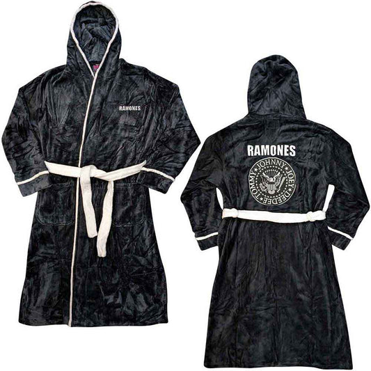 A man wearing a black fleece Ramones bathrobe with white trim against white background.