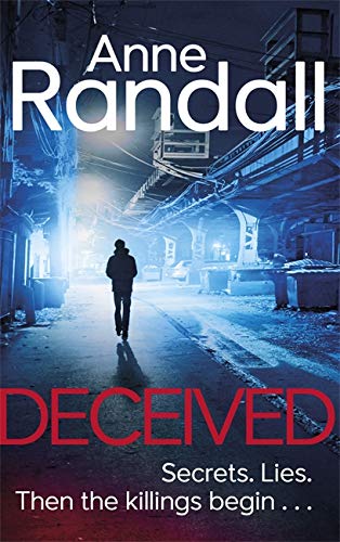 Book cover: a lone figure walks down a dark, tunnel-like street.