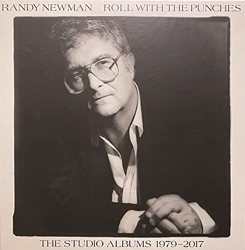 Black and white portrait of Randy Newman with glasses, album cover.