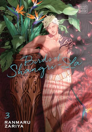 A shirtless man with blonde hair stands beside a large vase and tropical flowers.