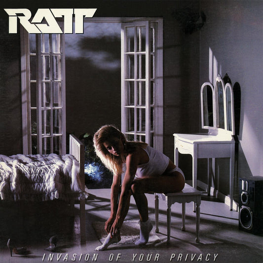 Ratt album cover: woman in a dimly lit, ornate room.