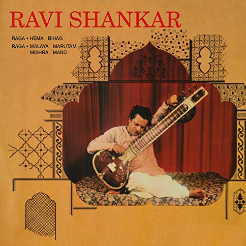Ravi Shankar album cover featuring a man playing a sitar on a patterned rug.