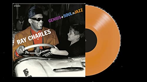 Ray Charles album cover and orange vinyl record against black background.