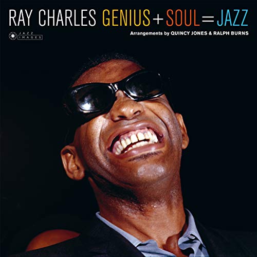 Ray Charles wearing sunglasses and laughing against a black background on album cover.