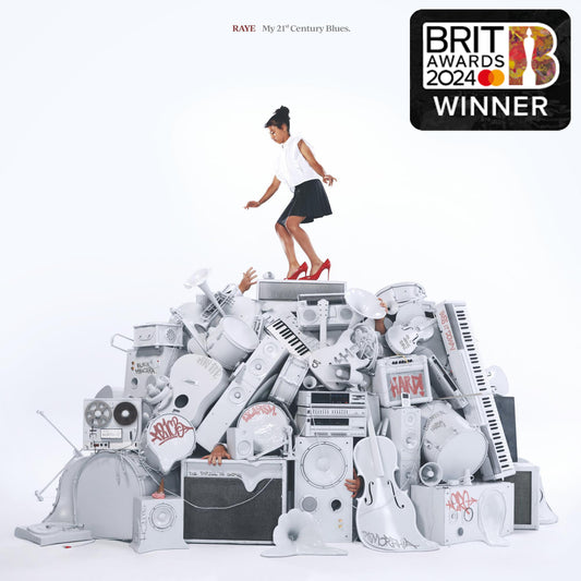 A woman stands atop a pile of white musical equipment on a CD cover.