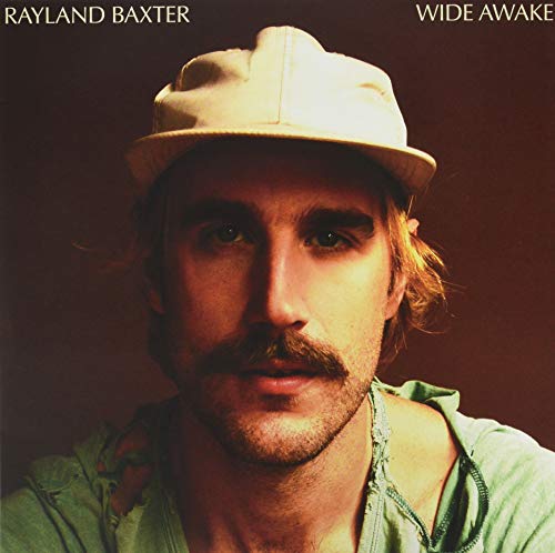 Rayland Baxter album cover featuring a portrait of a man in a hat.