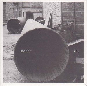 Black and white vinyl record cover with large cylindrical shapes.
