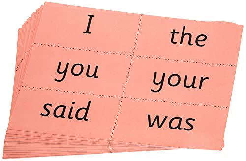 A stack of pink flashcards printed with common English words in black text.