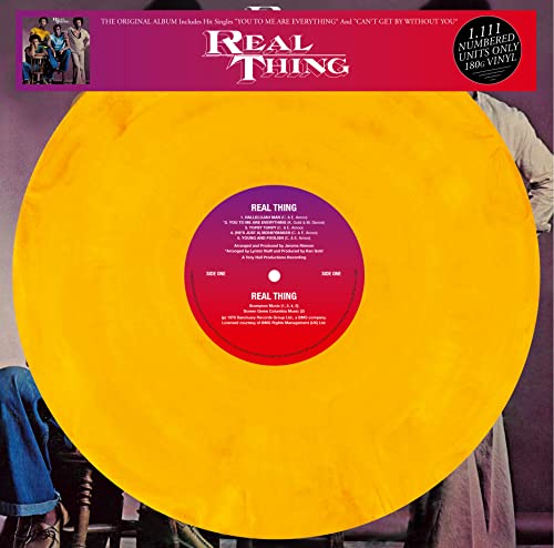 Marbled yellow vinyl record for "Real Thing" album, with label details.