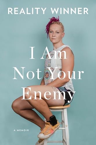 Book cover: woman with colorful hair seated on a stool.