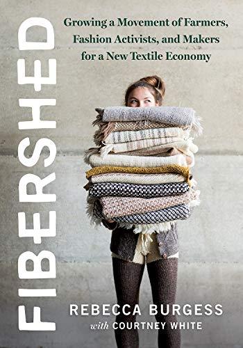 Book cover: woman holding a large stack of folded textiles.