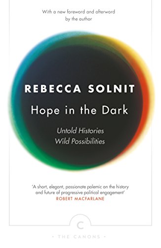 Book cover of Hope in the Dark by Rebecca Solnit featuring a colorful circle.
