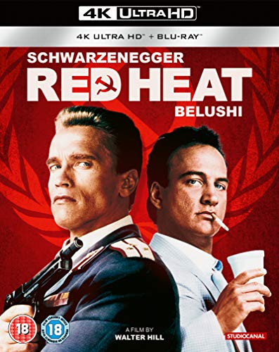 Red Heat 4K Blu-ray cover featuring Arnold Schwarzenegger and James Belushi on red background.