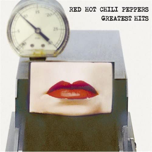 Album cover featuring a pressure gauge above a close-up of red lips.
