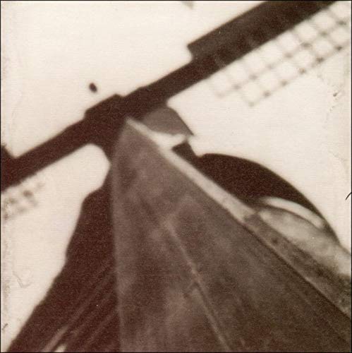 Sepia-toned CD cover with a blurred image of a boat and shadows.