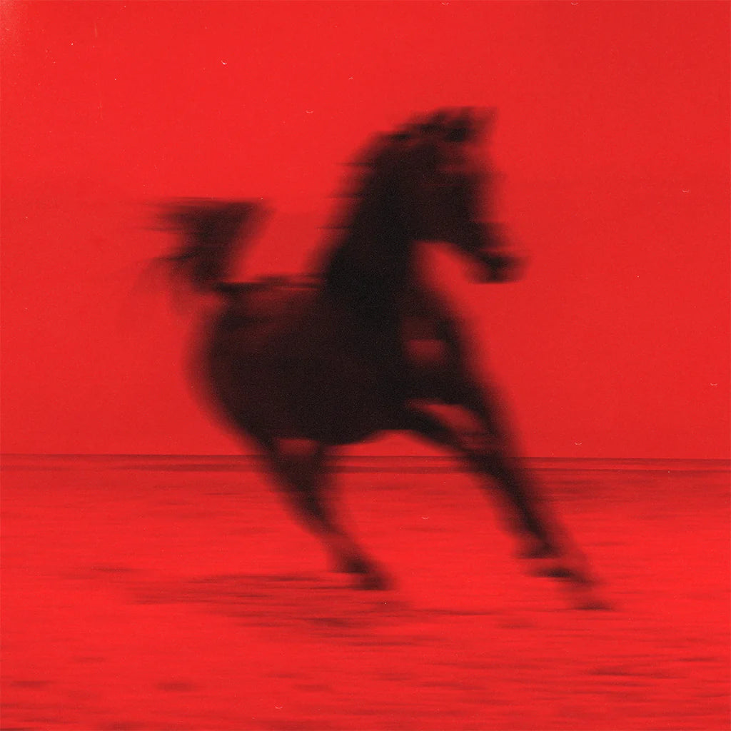 Red image of a blurred, dark horse silhouette against a gradient.