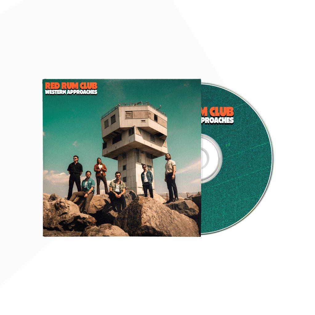 CD cover with band posing near a concrete tower against a sky.