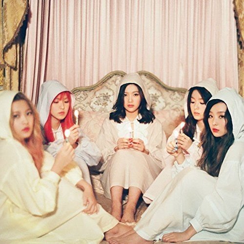 Red Velvet members in white robes with candles, album cover.