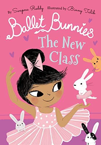 A young ballerina with dark hair and a pink tutu surrounded by small bunnies.