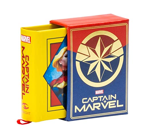 A small Captain Marvel book in a red and blue slipcase with gold emblem.