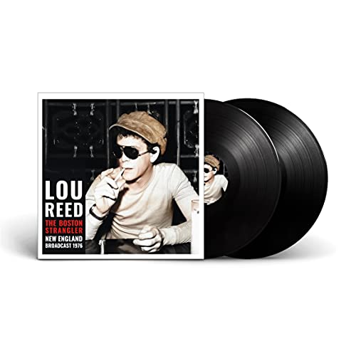 Lou Reed album cover with a man in a cap, and two vinyl records.