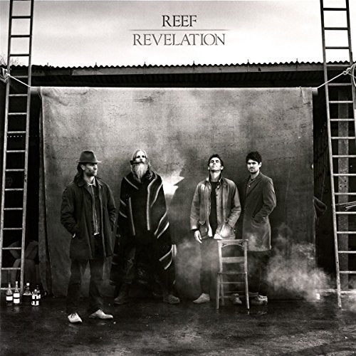 Black and white vinyl album cover with four men standing in front of a backdrop.