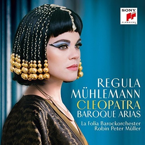 CD cover: Regula Mühlemann as Cleopatra, ornate gold jewelry, teal background.