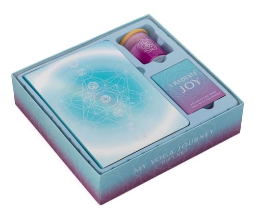 Blue gift box containing a journal, cards, and a small candle.