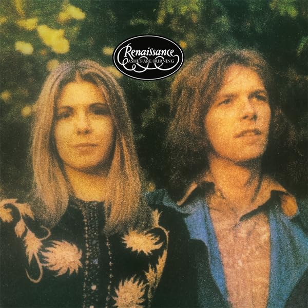 Album cover featuring a man and woman against a dark, leafy background.