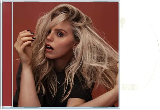 Reneé Rapp album cover: blonde woman with flowing hair, red background.