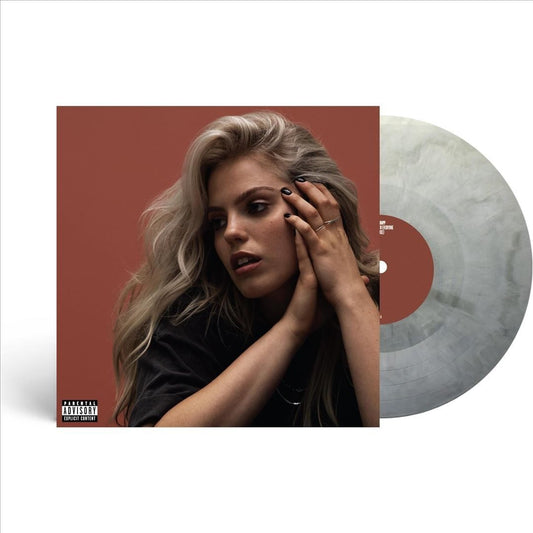 Reneé Rapp album cover with artist portrait and vinyl record shown.