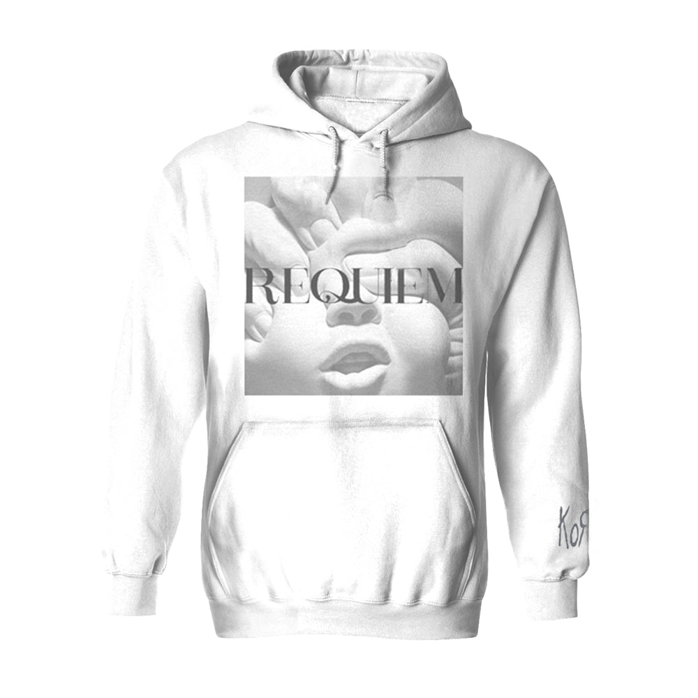 White hoodie with a black and white face and "REQUIEM" text print.
